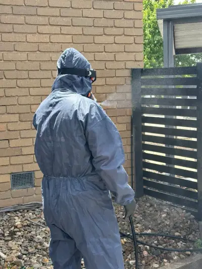 Exterior brick wall perimeter pest spray treatment